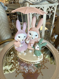 Famille Lapin sous la Pluie