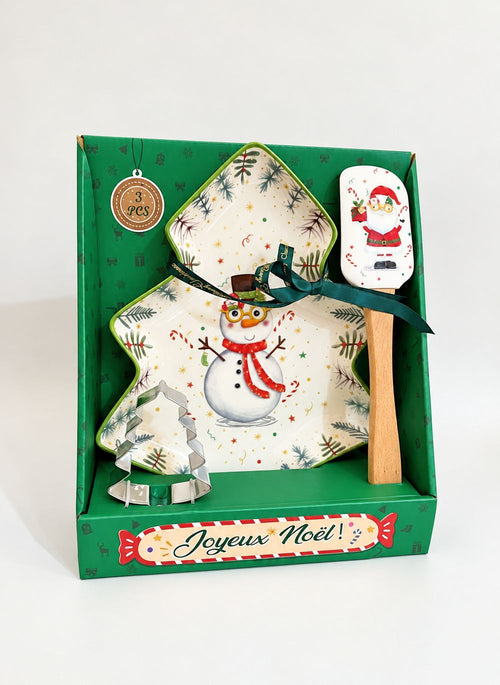 Coffret Snowman de Noël dans son emballage vert, avec plat sapin, spatule Père Noël et emporte-pièce sapin.