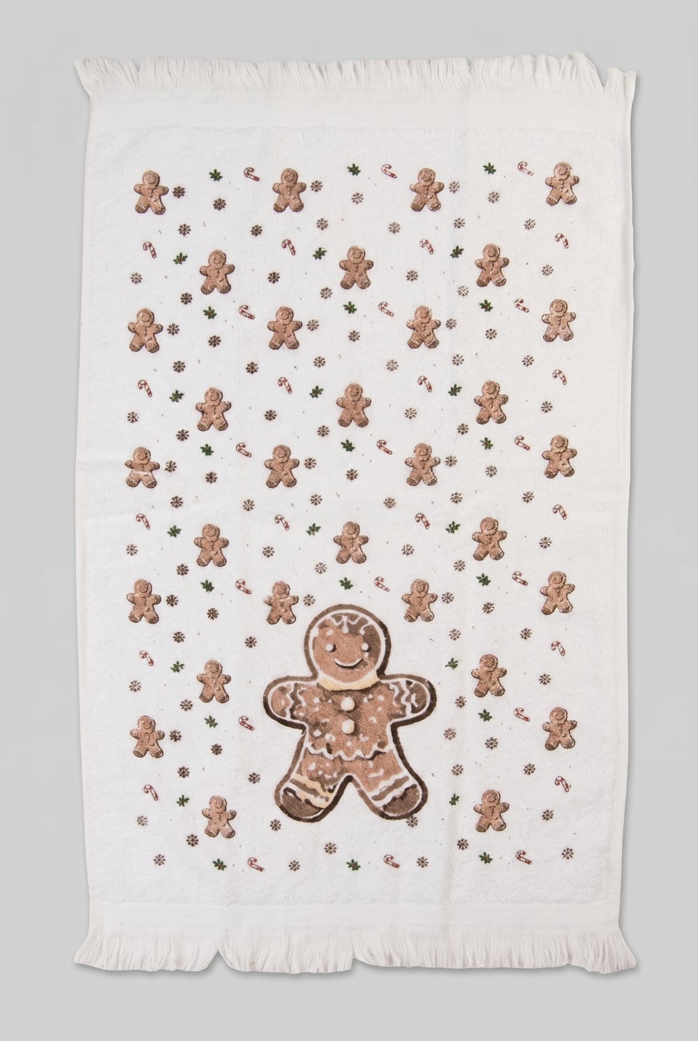 Essuie-mains en coton blanc décoré d'un grand bonhomme pain d'épices avec petits motifs hivernaux et détails festifs, pour cuisine chaleureuse et décoration de Noël