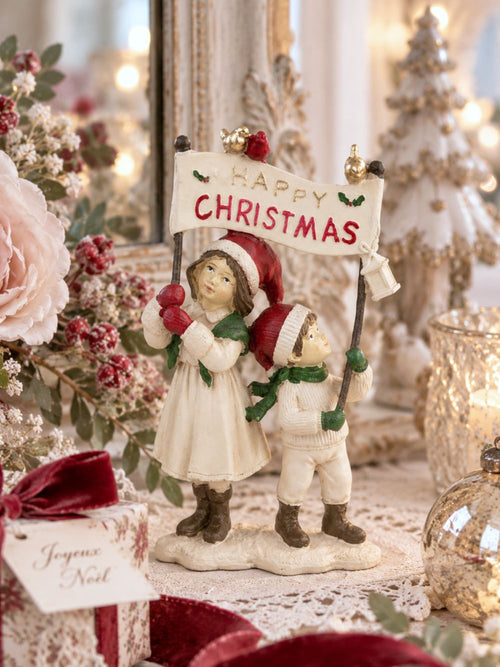 Figurine décorative de Noël représentant des enfants avec inscription Happy Christmas, tons doux et festifs, décoration de charme pour ambiance féérique hivernale