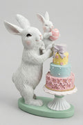 Figurine décorative représentant une maman lapin et son bébé, tons blanc rose et vert d’eau, ambiance shabby chic romantique et poétique, décoration de Pâques pleine de tendresse.