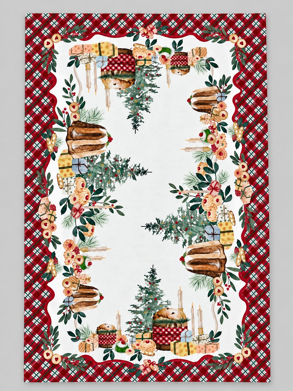 Nappe Gourmandises de Noël déployée sur fond gris clair, avec motifs de pâtisseries, sapins et cadeaux et bordure écossaise rouge et verte.