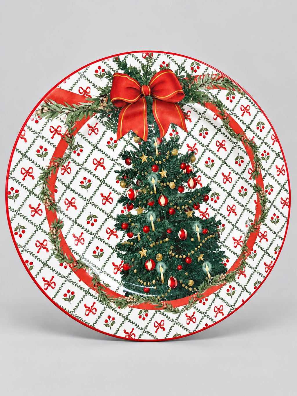 Plateau rond Sapin de Fête en métal émaillé, décor de sapin et nœud rouge sur fond gris clair.
