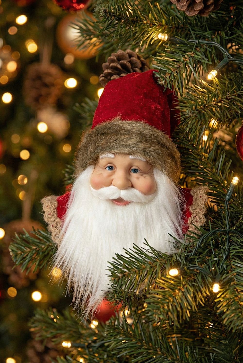 Suspension décorative tête de Père Noël, décoration de Noël à suspendre aux tons rouges et blancs, style traditionnel et féérique pour sapin ou intérieur de charme